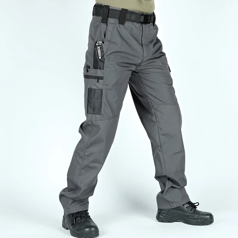 Durable grey trekking trousers SF2061 with multiple pockets, ideal for hiking and outdoor activities, featuring reinforced knees.